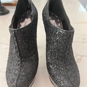 Mui Mui black glitter platforms
